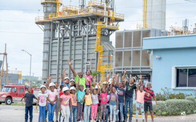 Camp Ablaze 23: Children from Farm Heights and Rose Heights communities pose for a group photo with Allaine Harvey, JPS Foundation Programme Officer, at JPS Bogue Power Plant as part of the activities of the JPS Foundation Summer Camp Ablaze, held at the Farm/Rose Heights Community Centre. Over 50 youngsters enjoyed a week of fun and educational activities at the annual non-residential summer camp in July.